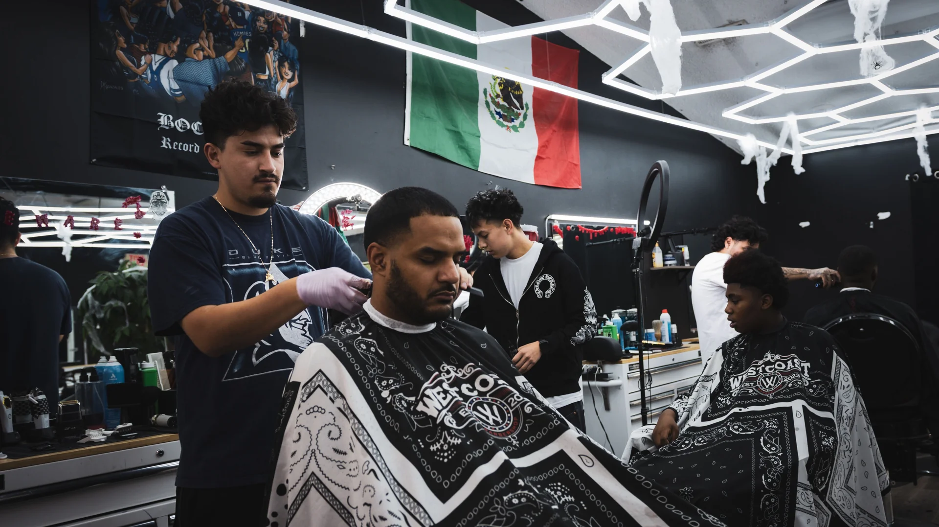 Barbers at work in the West Coast Barbershop shop